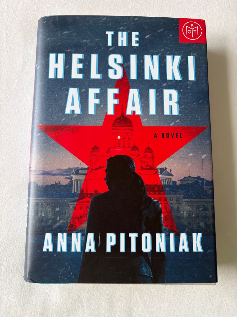 The Helsinki Affair by Anna Pitoniak - Blue & Red Hardcover Novel